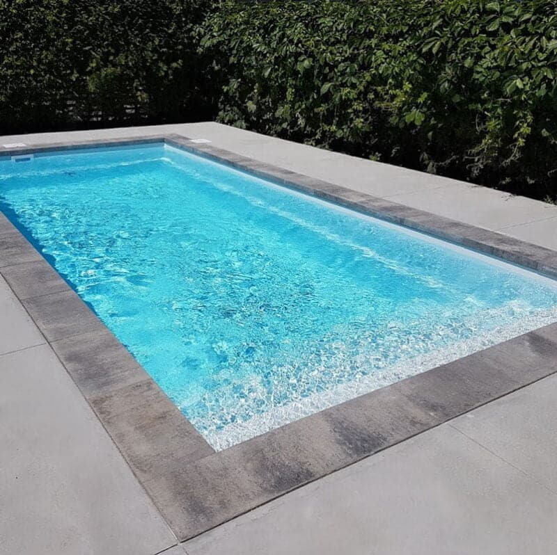 Fiberglass inground pool in backyard | Nautika Pools